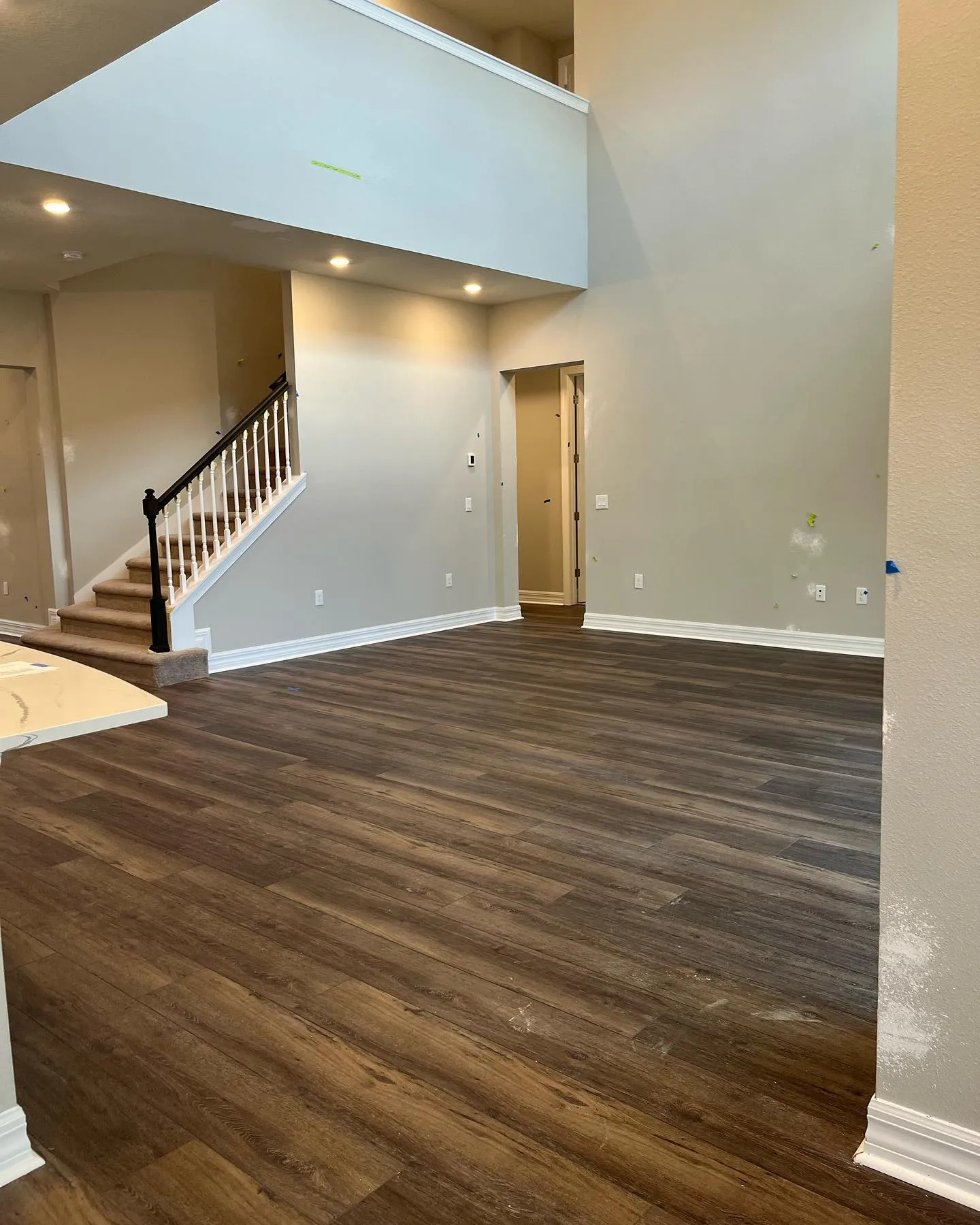 Dark vinyl plank in a two-story open living room